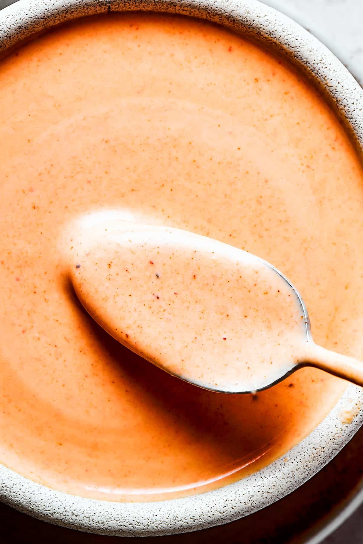 A close-up photo of Homemade yum yum sauce in a bowl.