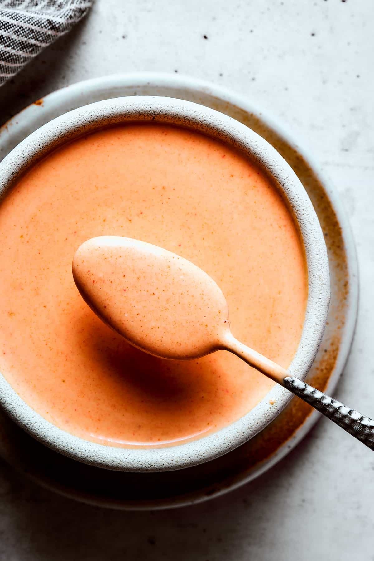 Homemade yum yum sauce in an earthenware bowl.
