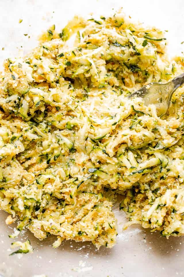 shredded zucchini in a glass bowl