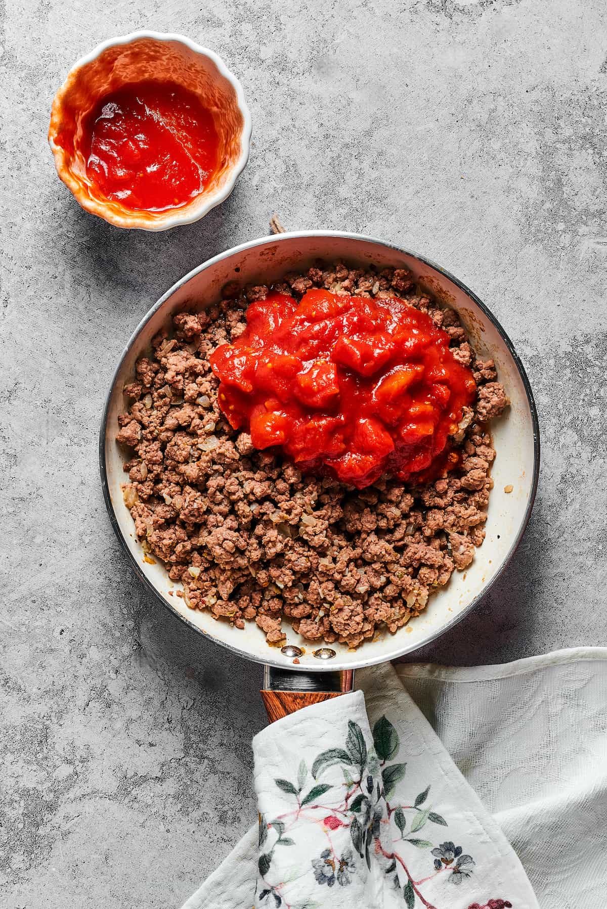 Meat sauce ingredients in a skillet.