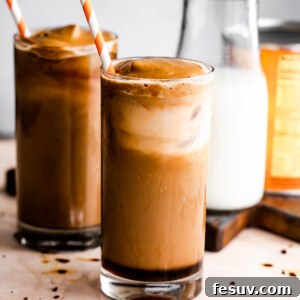 Pumpkin Cream Cold Brew served in two drinking glasses with a milk bottle placed right beside them.