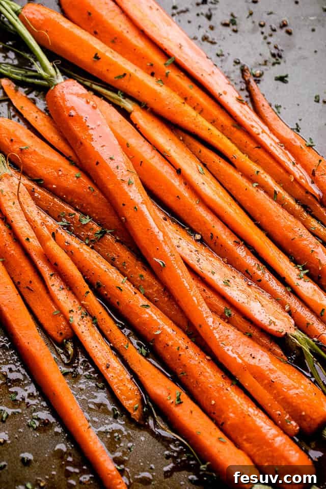 Honey Balsamic Roasted Carrots: A simple, flavorful, and easy-to-make vegetable side dish for any meal. Pan of sweet Honey Balsamic Oven Roasted Carrots, perfectly caramelized and ready to serve.