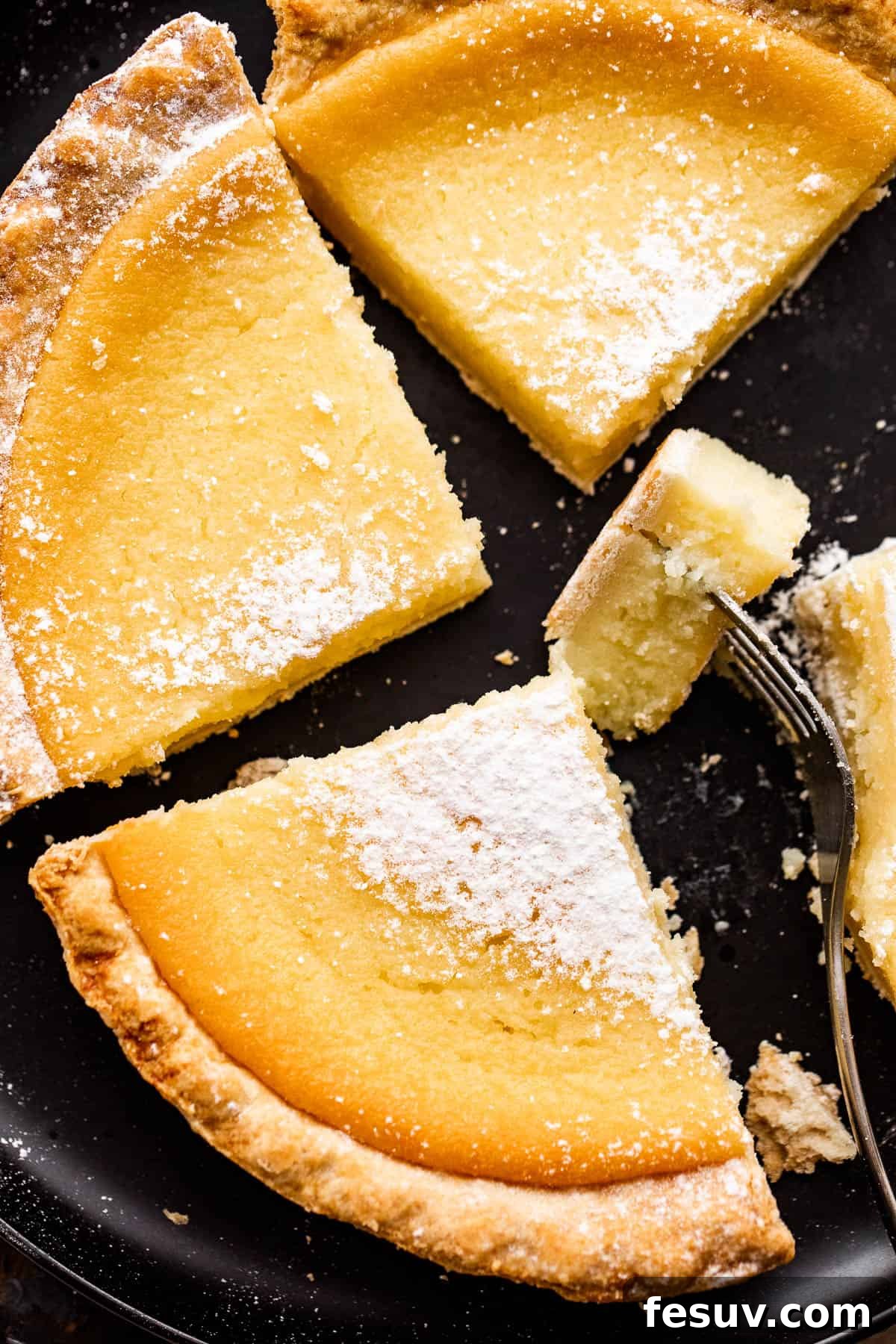 Close-up shot of a pie with a slice removed, showing the texture of the custard.