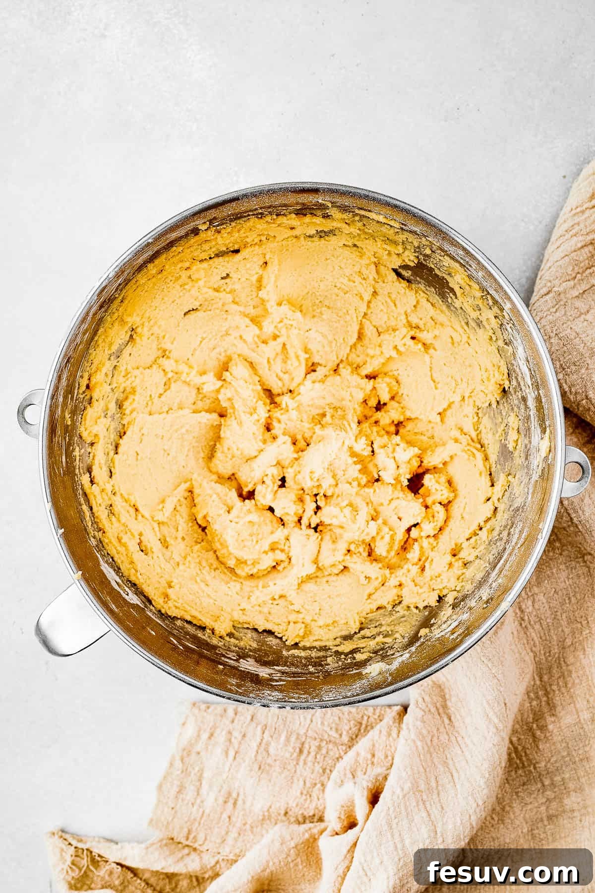 Overhead shot of a mixing bowl full of cookie dough.