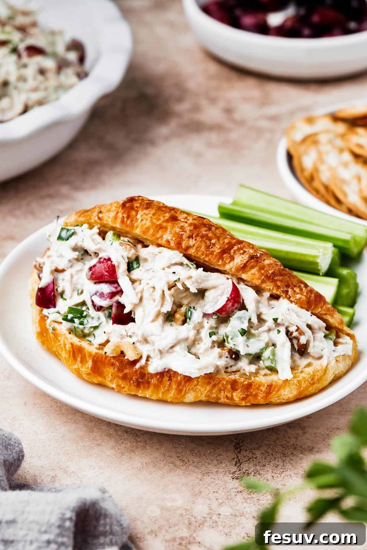 Chicken salad in a split croissant, ready to be served.