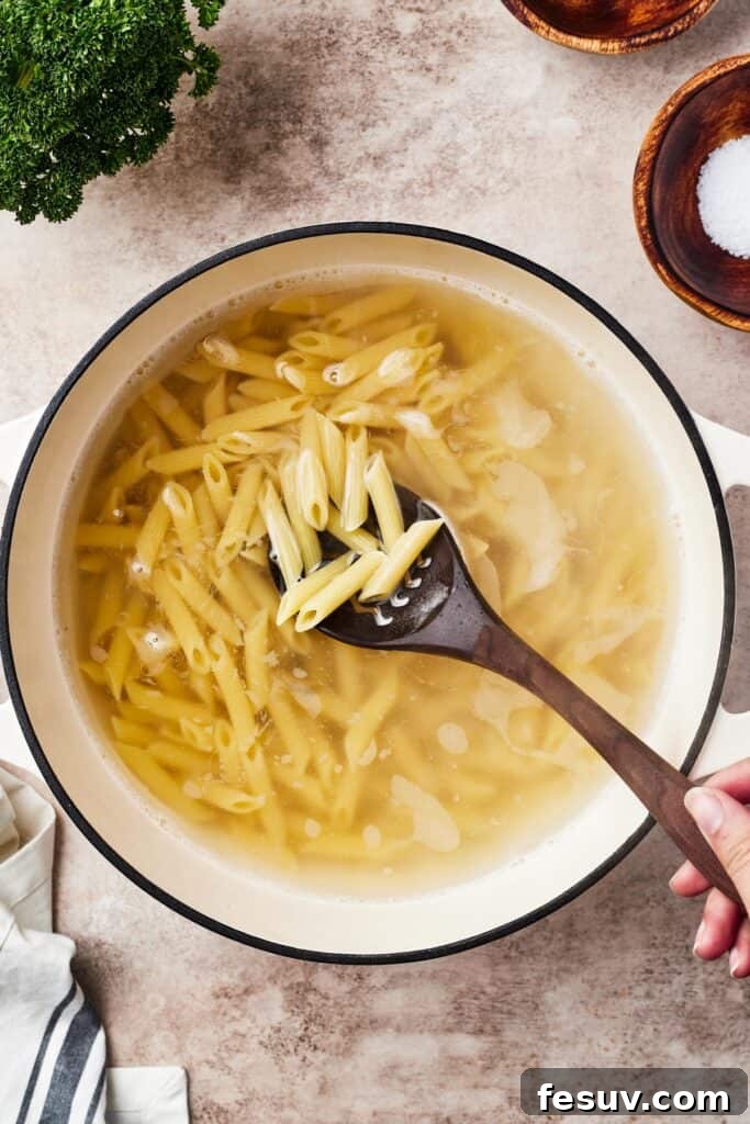 Pasta boiling in a large pot.