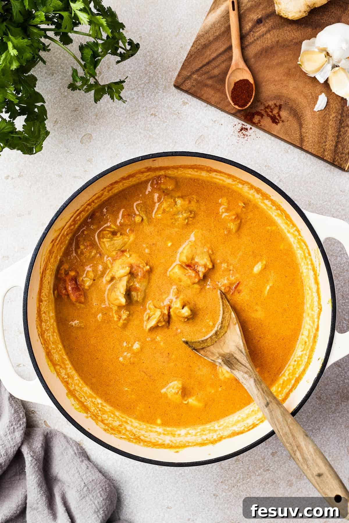 Creamy chicken curry in a heavy pot.