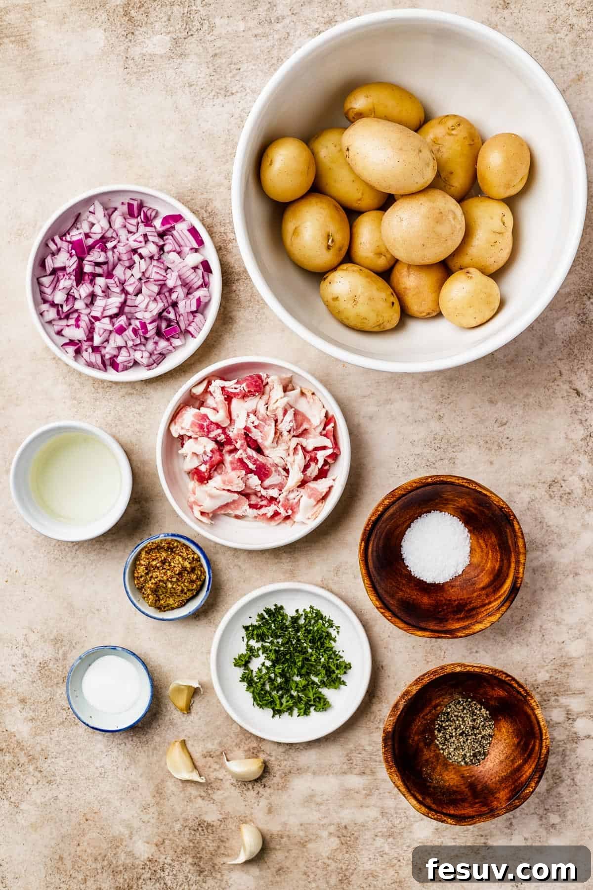 From top: Whole yellow potatoes, chopped red onion, white wine vinegar, chopped bacon, whole grain mustard, salt, sugar, garlic, parsley, pepper.