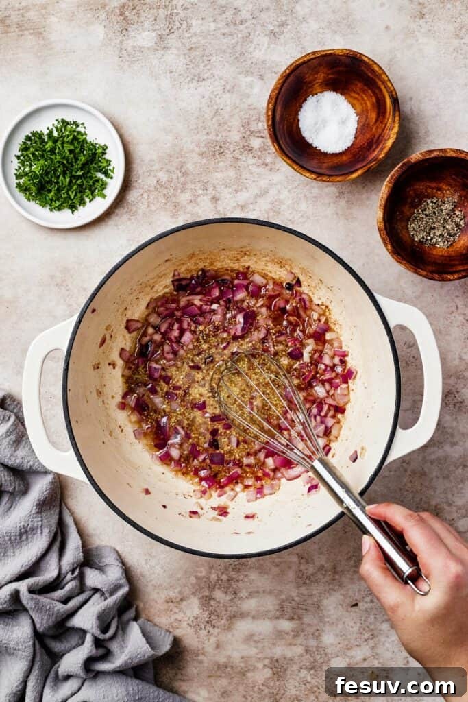 Red onion and garlic in a pot.