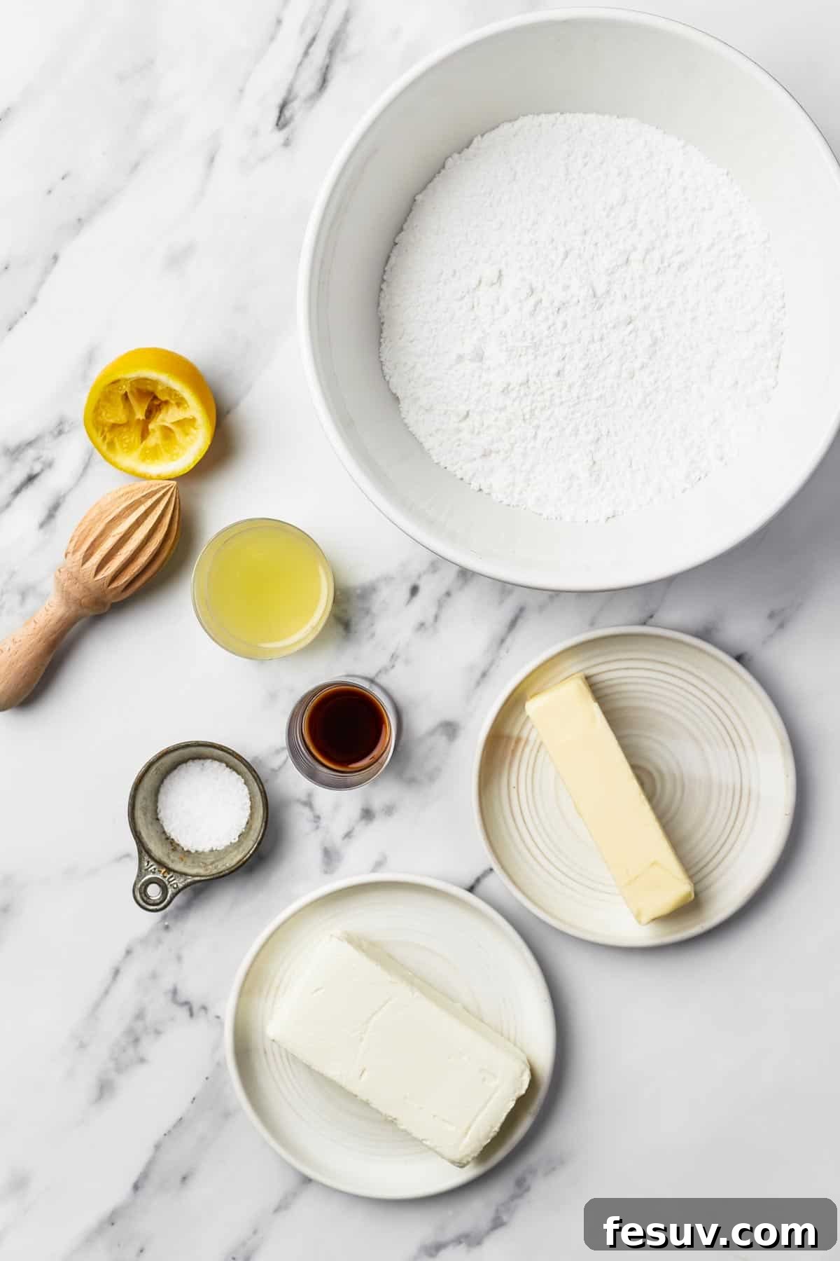 From top: Powdered sugar, butter, vanilla, salt, cream cheese, white vinegar.