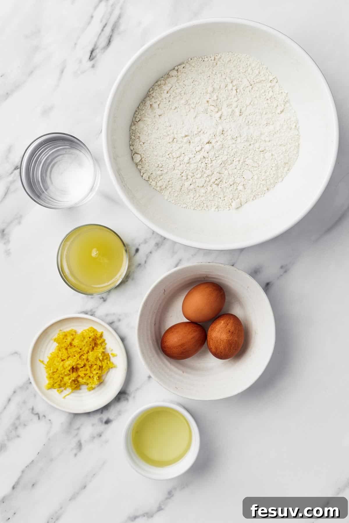 Zesty Lemon Bundt Delight 4 From top left: Water, cake mix, oil, eggs, lemon zest, and lemon juice.