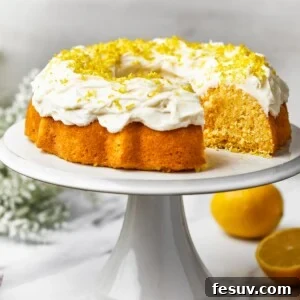 A Bundt cake on a platter, with one slice cut out.
