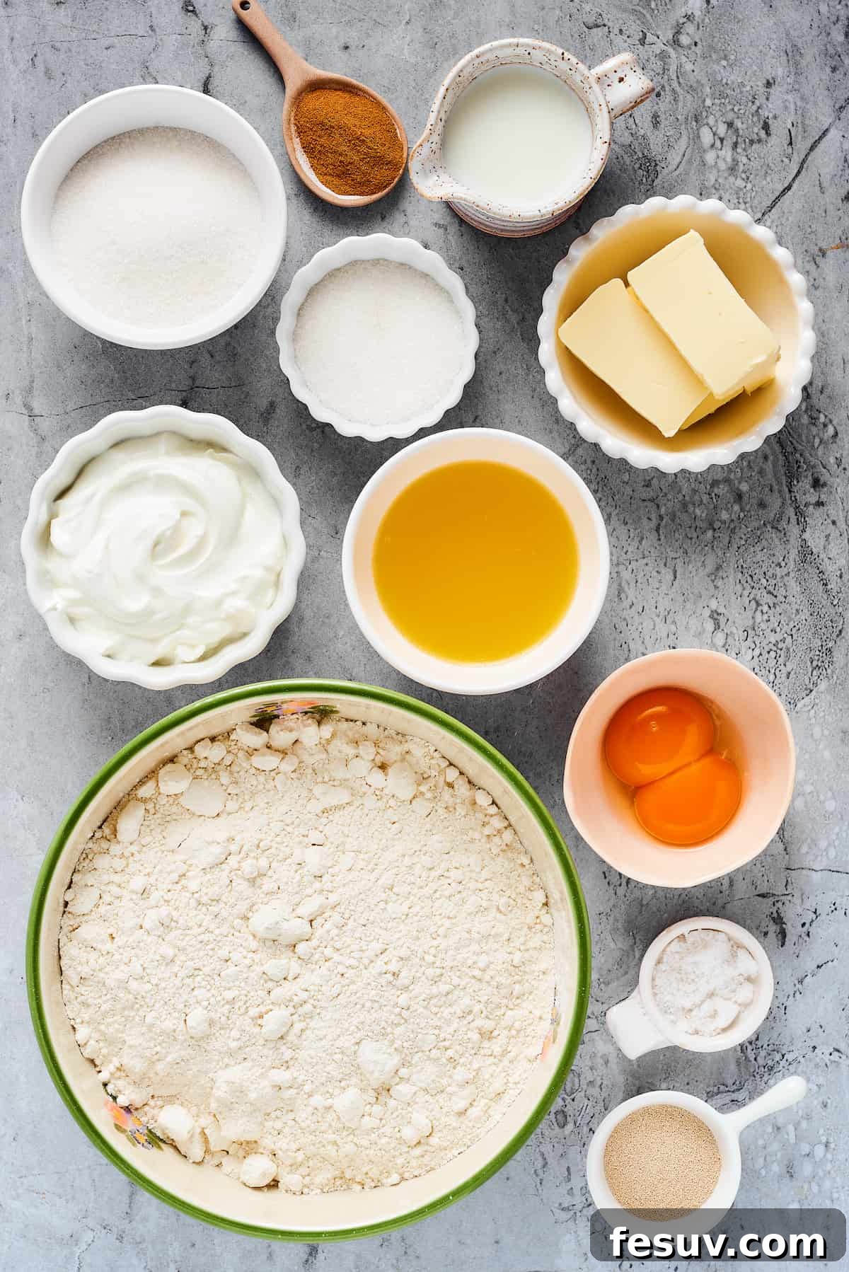 From top left: Sugar, cinnamon, milk, granulated sugar, butter, heavy cream, melted butter, melted butter, egg yolks, spelt flour, salt, instant yeast.