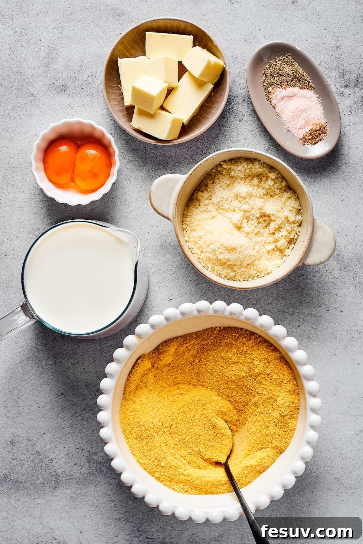 From top: Butter, seasonings, egg yolks, parmesan cheese, milk, semolina - essential ingredients for Gnocchi alla Romana.
