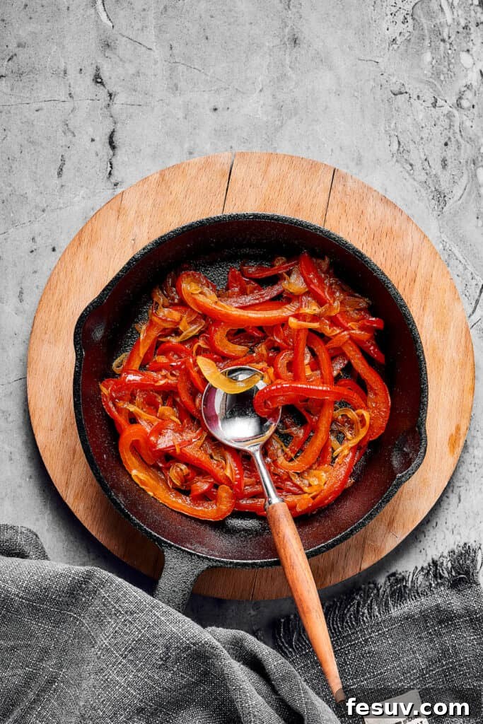 The Ultimate Shakshuka 6 Cooked vegetables in a cast-iron skillet.