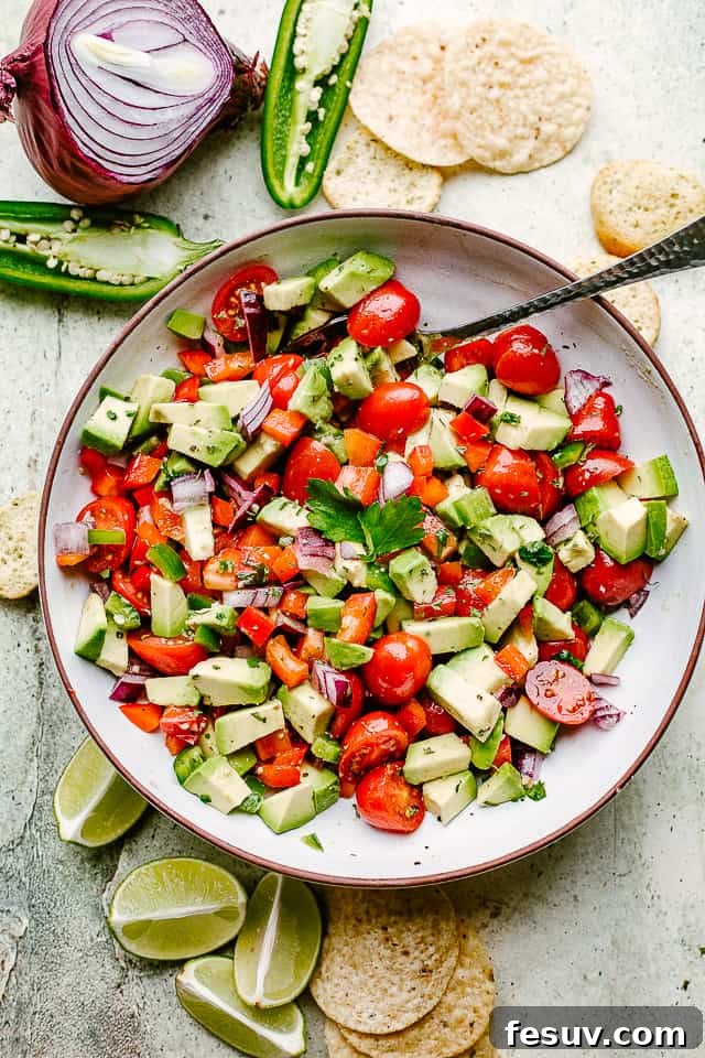 Perfectly Paired Avocado Salsa and Crispy Tortilla Chips A rustic bowl brimming with homemade avocado salsa, surrounded by golden tortilla chips, inviting you to dive in.