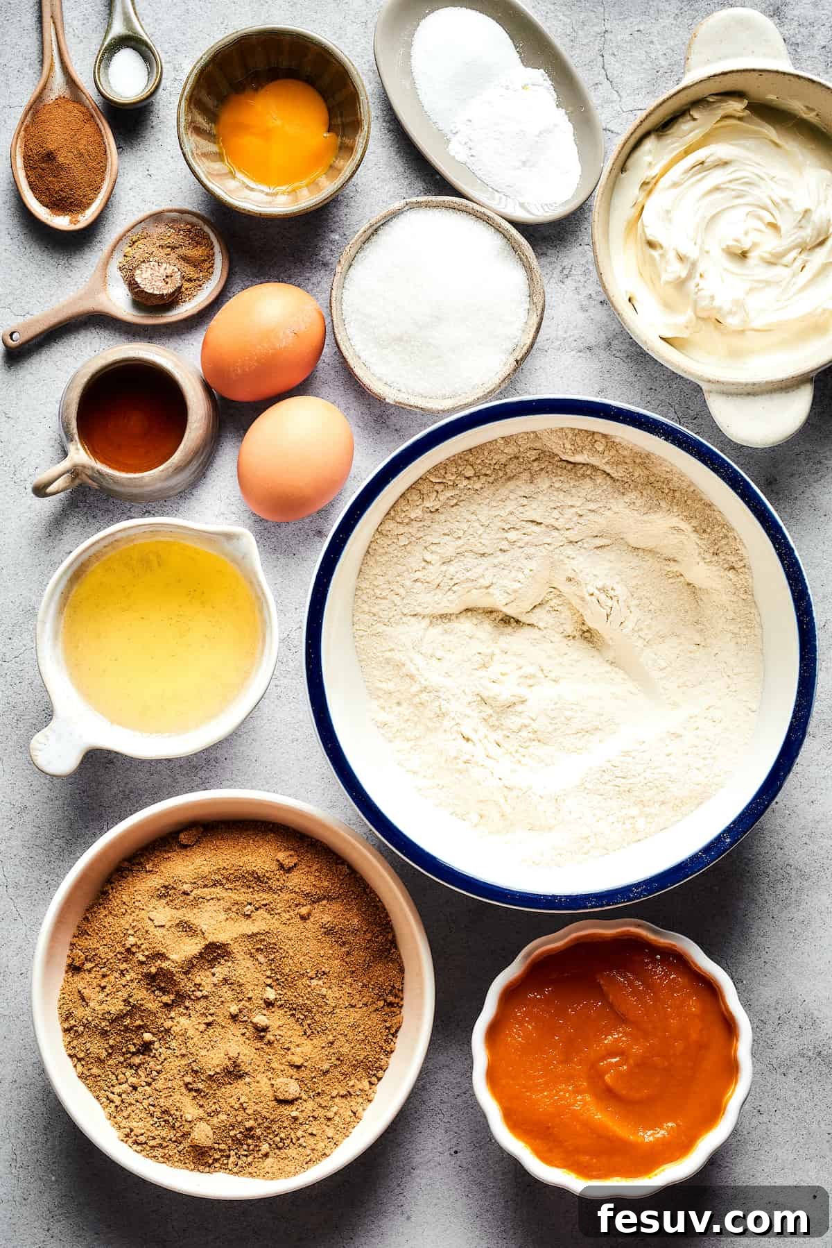 Pumpkin Cream Cheese Muffins are a heavenly mix of spiced pumpkin cake and smooth cream cheese swirl, with a buttery, streusel-like topping. From top: Cinnamon, salt, eggs and an egg yolk, baking powder and baking soda, cream cheese, white sugar, vegetable oil, flour, brown sugar, pumpkin puree.