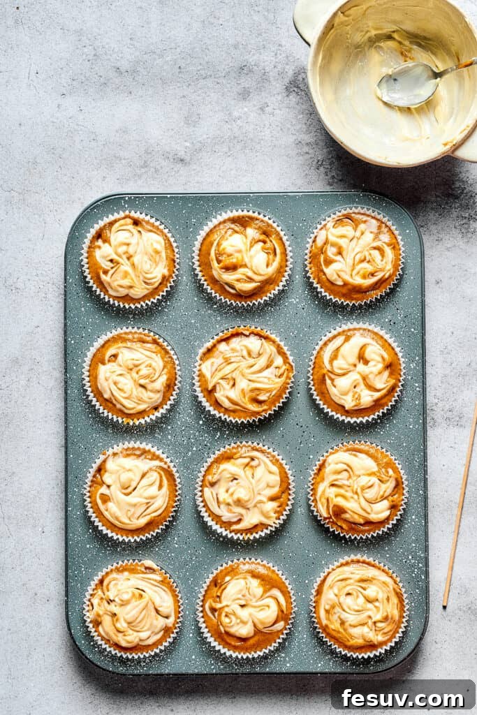 Cream Cheese Swirl Pumpkin Muffins 6 Unbaked pumpkin cream cheese muffins.