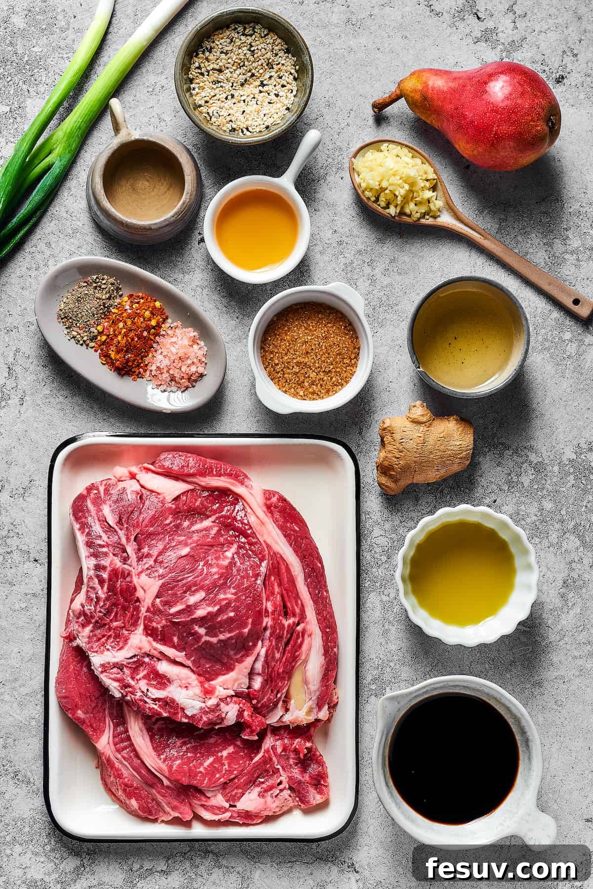 From top left: Green onions, toasted sesame seeds, a fresh pear, sesame oil, mirin, minced garlic, spices, brown sugar, oil, steak, ginger, soy sauce.