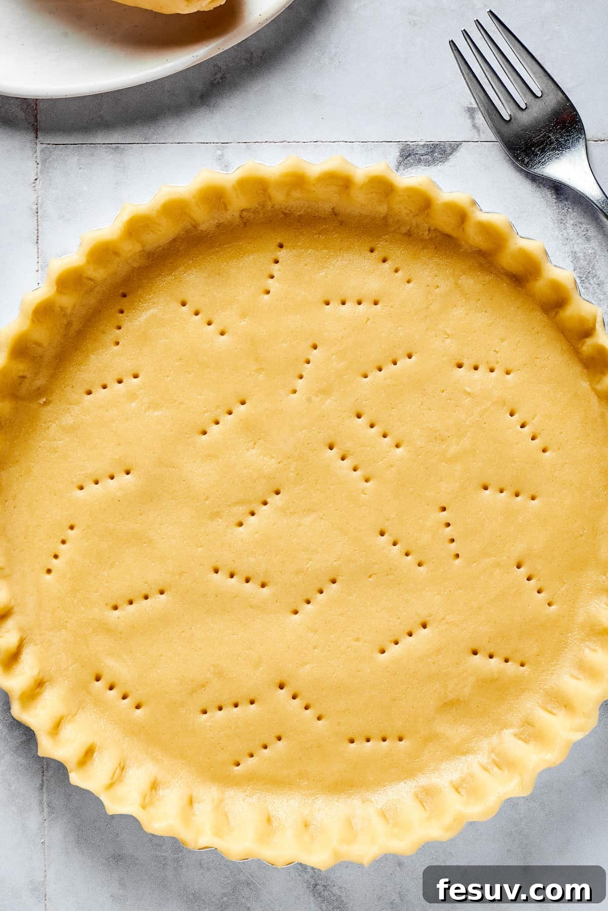 A freshly baked, golden-brown homemade pie crust, ready for filling.