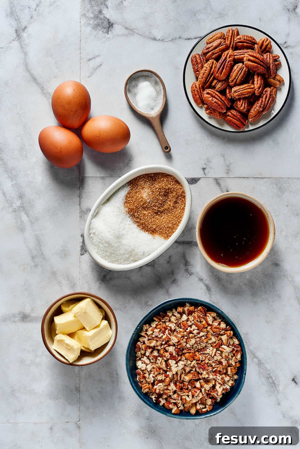 The Best Pecan Pie Recipe is here, easy to make and perfect for your holiday table! You'll love the homemade crust and sweet, nutty filling. From top left: Eggs, salt, pecans, white and brown sugar, maple syrup, butter, chopped pecans.