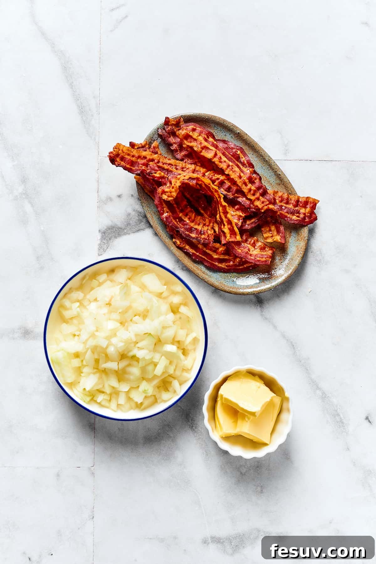 Topped with caramelized onion and crispy bacon, this easy Homemade Pierogi Recipe features a traditional cheese and potato filling. Yum! Ingredients for pierogi topping: crispy-cooked bacon, chopped yellow onion, and unsalted butter.