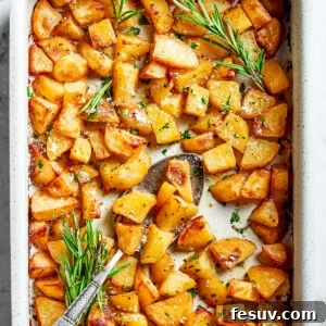 Foolproof Roasted Potatoes 5 A large baking dish full of baked, seasoned potato pieces.