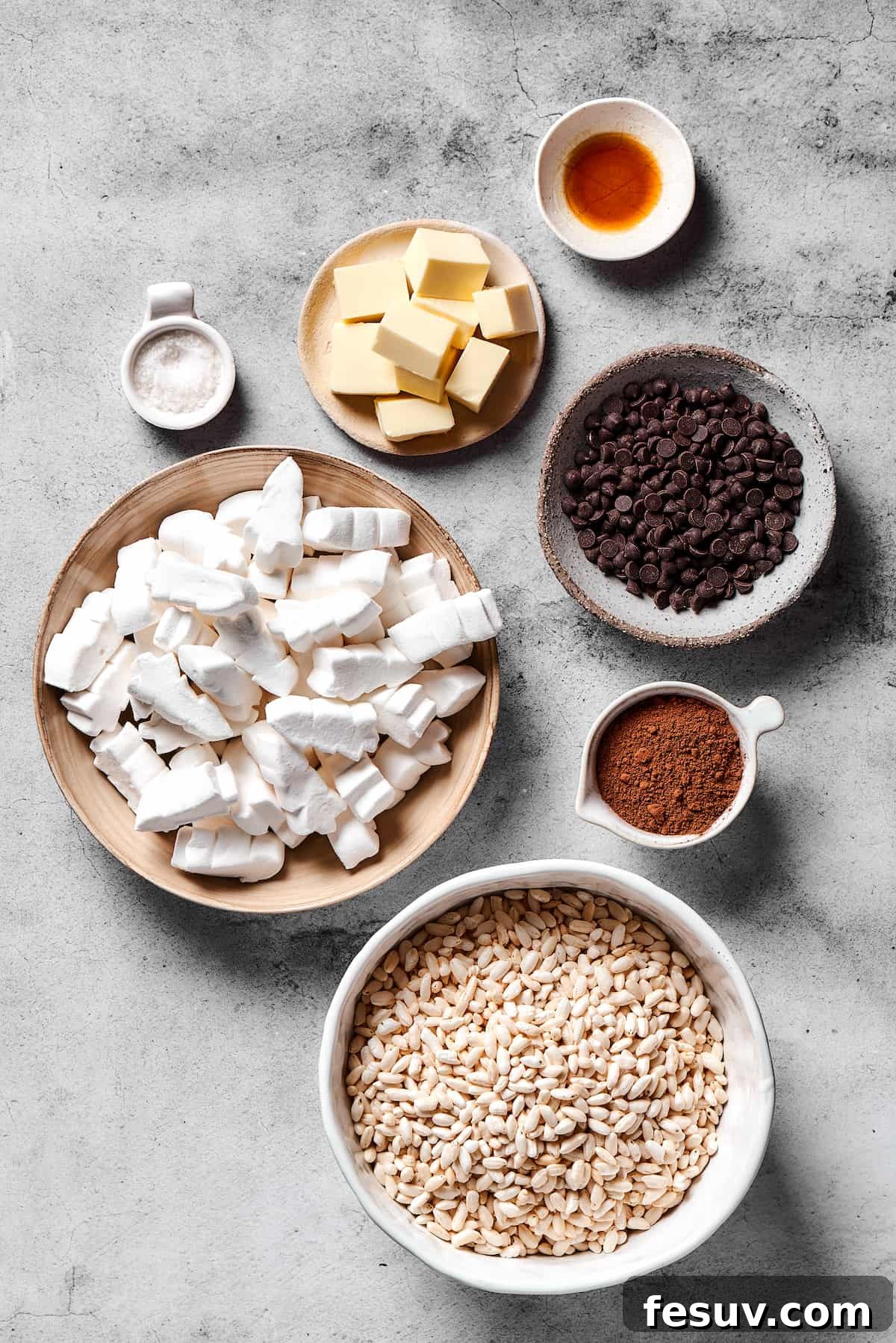 Chocolate Rice Krispie Treats are light and crunchy, with a sticky marshmallow texture and real dark chocolate. Easy and scrumptious! From top: Vanilla, chocolate chips, cocoa powder, crispy rice cereal, marshmallows, butter, flaky sea salt.