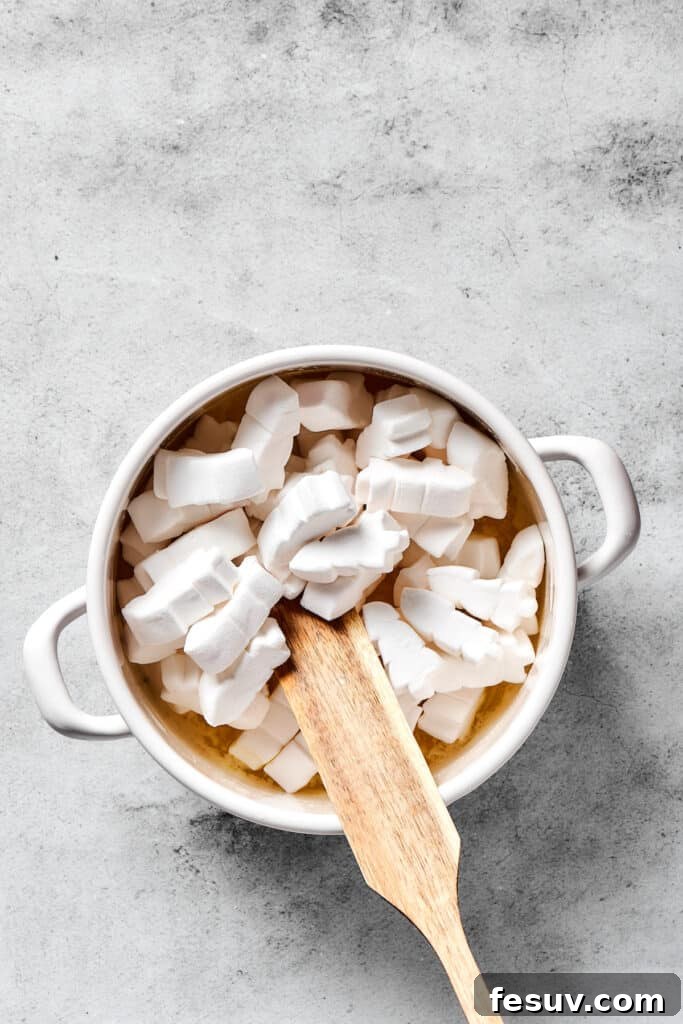 Irresistible Chocolate Krispie Squares 3 Stirring marshmallows into melted butter.