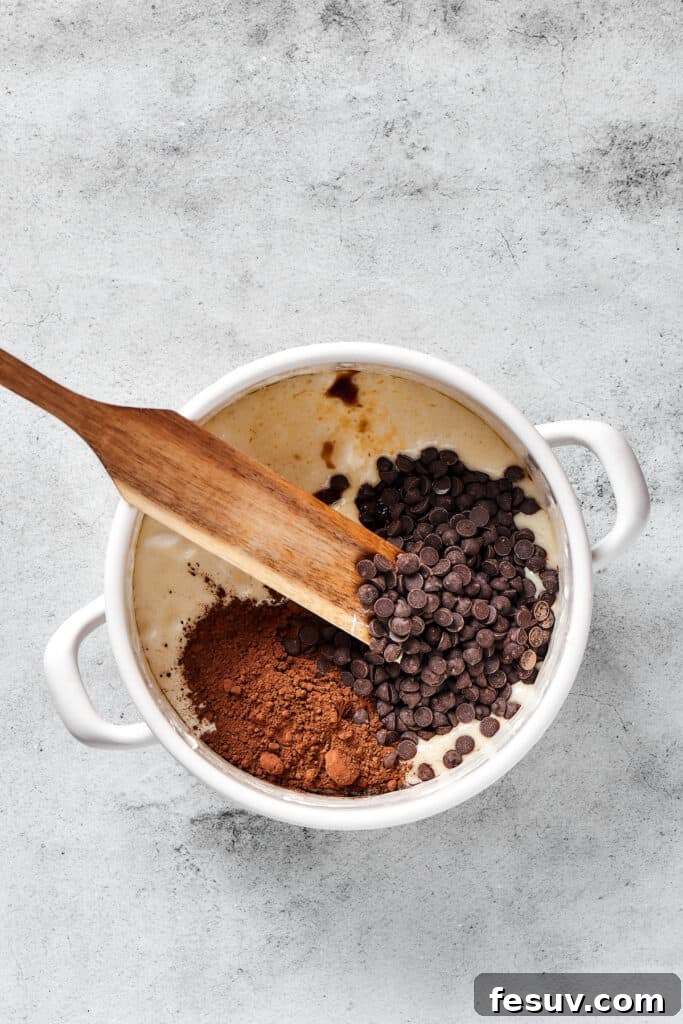 Irresistible Chocolate Krispie Squares 4 Stirring chocolate chips and cocoa powder into a melted butter mixture.