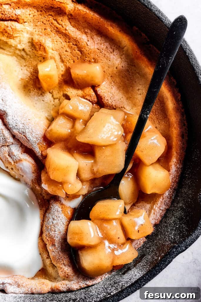 Skillet Cloud Pancake 9 A skillet pancake with apples and creamy topping.