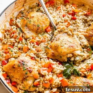scooping out chicken thighs set on a bed of rice inside a white skillet