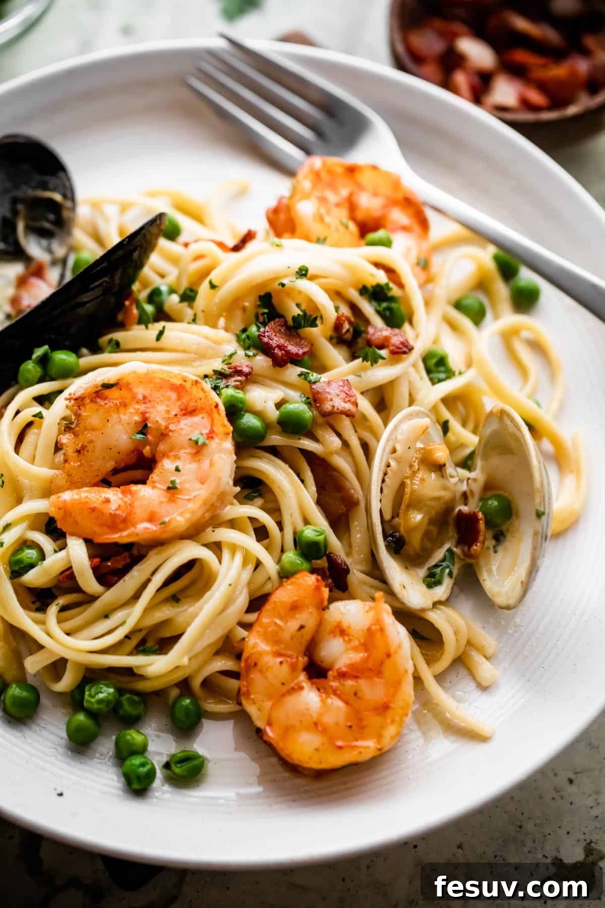 Velvet Seafood Pasta 3 close up shot of a dinner plate with Creamy Pasta with shrimp and mussels.