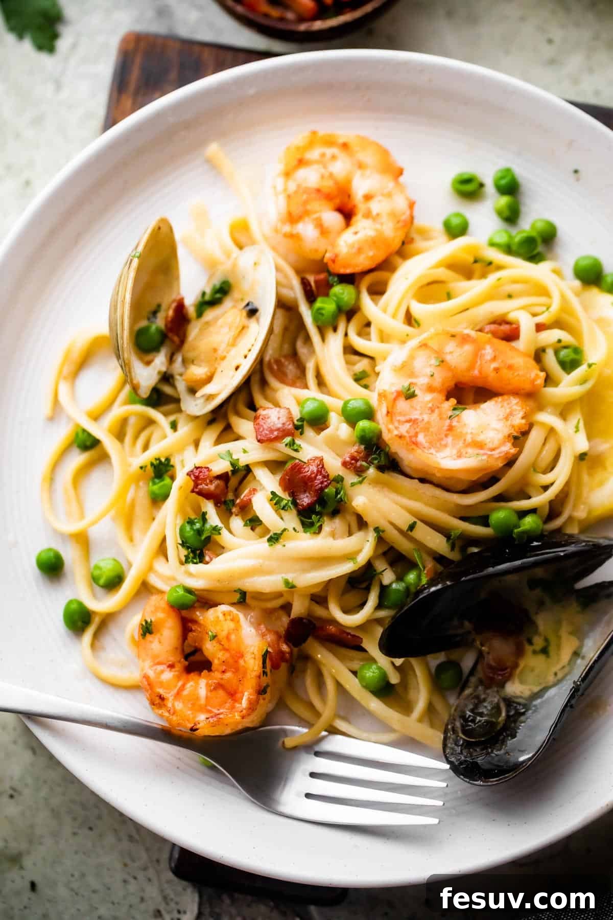Velvet Seafood Pasta 5 overhead shot of a dinner plate with Creamy Pasta with shrimp and mussels.
