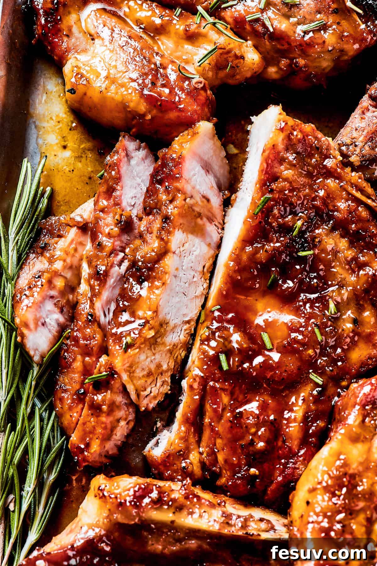 Perfectly Cooked and Sliced Brown Sugar Pork Chop A perfectly cooked brown sugar pork chop, sliced to reveal its juicy interior and tender texture.