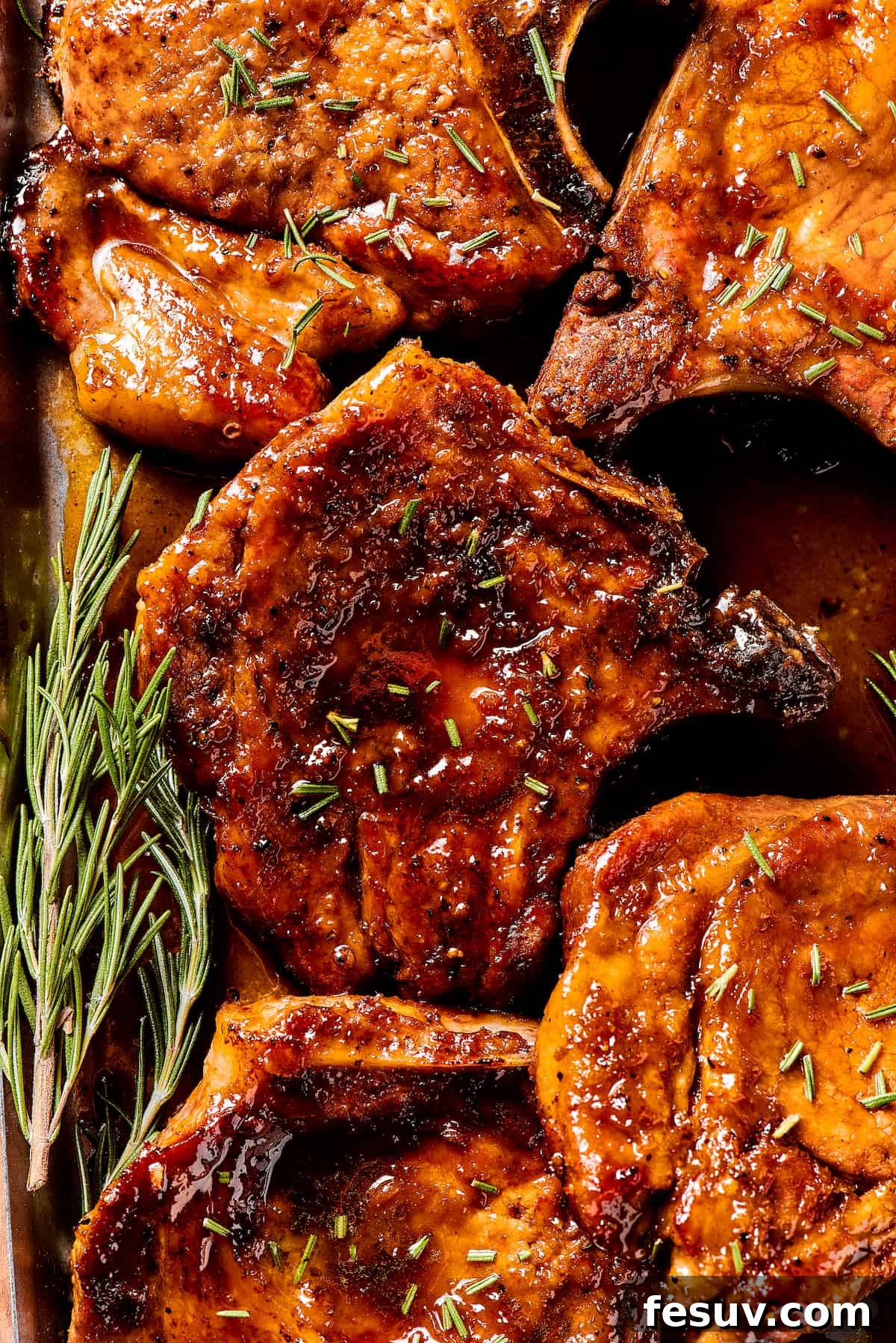 Sweet and Savory Pork Chops Garnished with Fresh Herbs A dish of brown sugar pork chops adorned with fresh green herbs, showcasing the rich glaze.