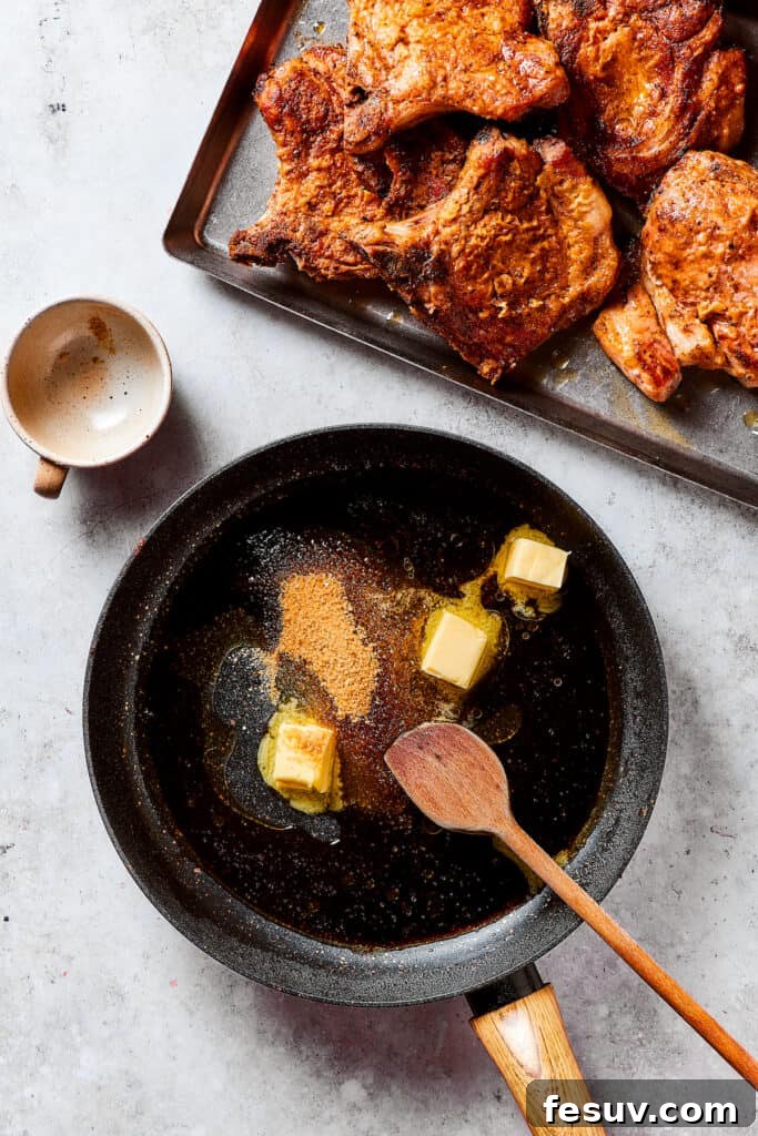 Preparing the Brown Sugar Glaze in the Skillet Making pan sauce with melted butter, water, and brown sugar in a skillet.