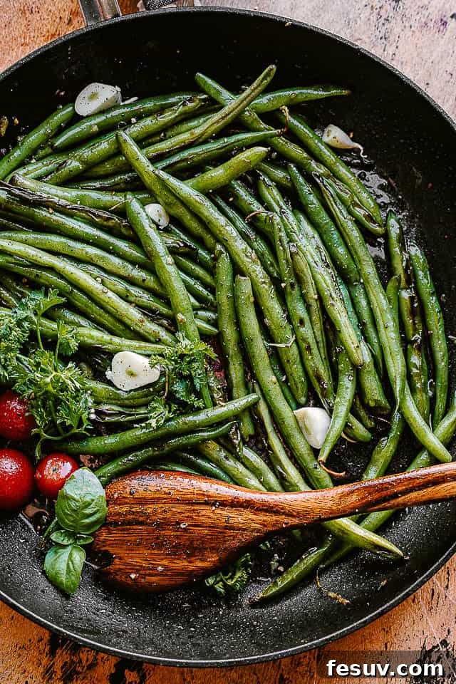 green beans cooking in a black skillet