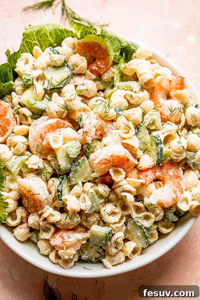 Top view of a Creamy Shrimp Pasta Salad in a white salad bowl