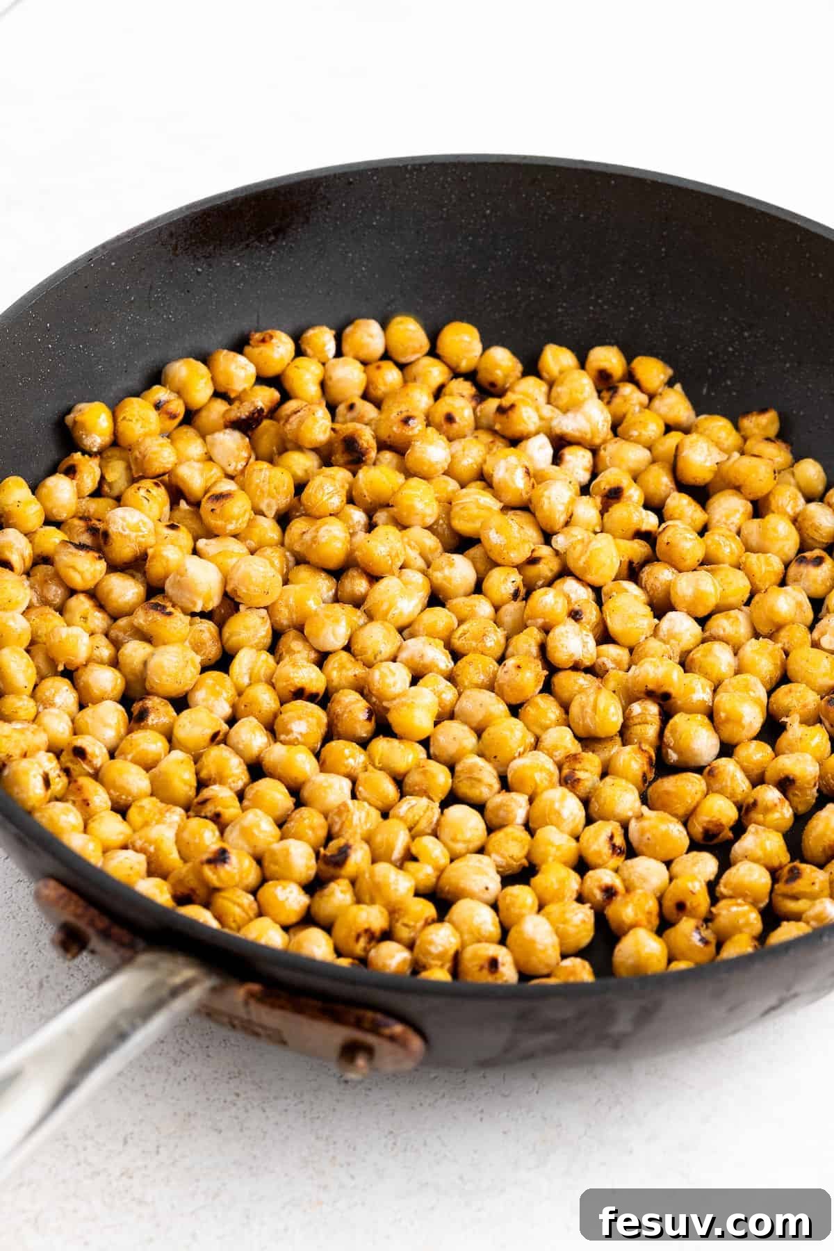 Pan-roasting the chickpeas.