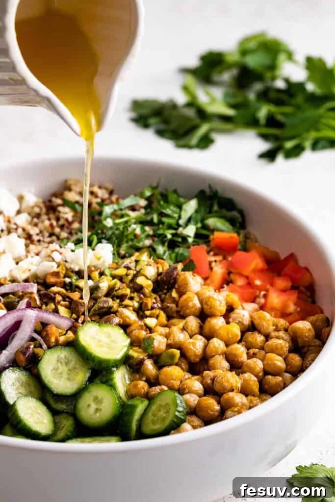 Pouring the dressing into the salad.