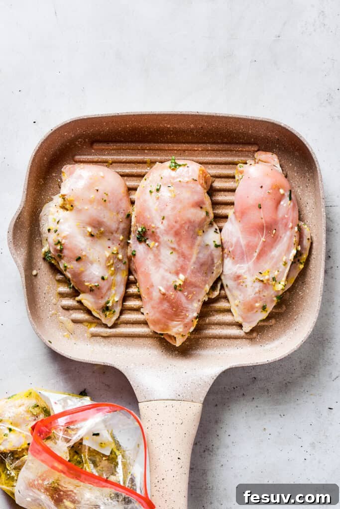 Fresh, flavorful Lemon Chicken is incredibly easy to make, and totally mouthwatering, too! Black pepper, garlic, fresh herbs, and lemon. Yum! Cooking chicken on a grill pan, showing a perfect sear.