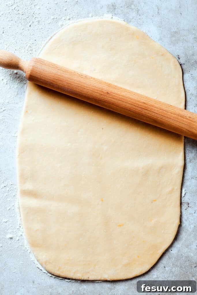 Dough rolled out into a thin rectangle.