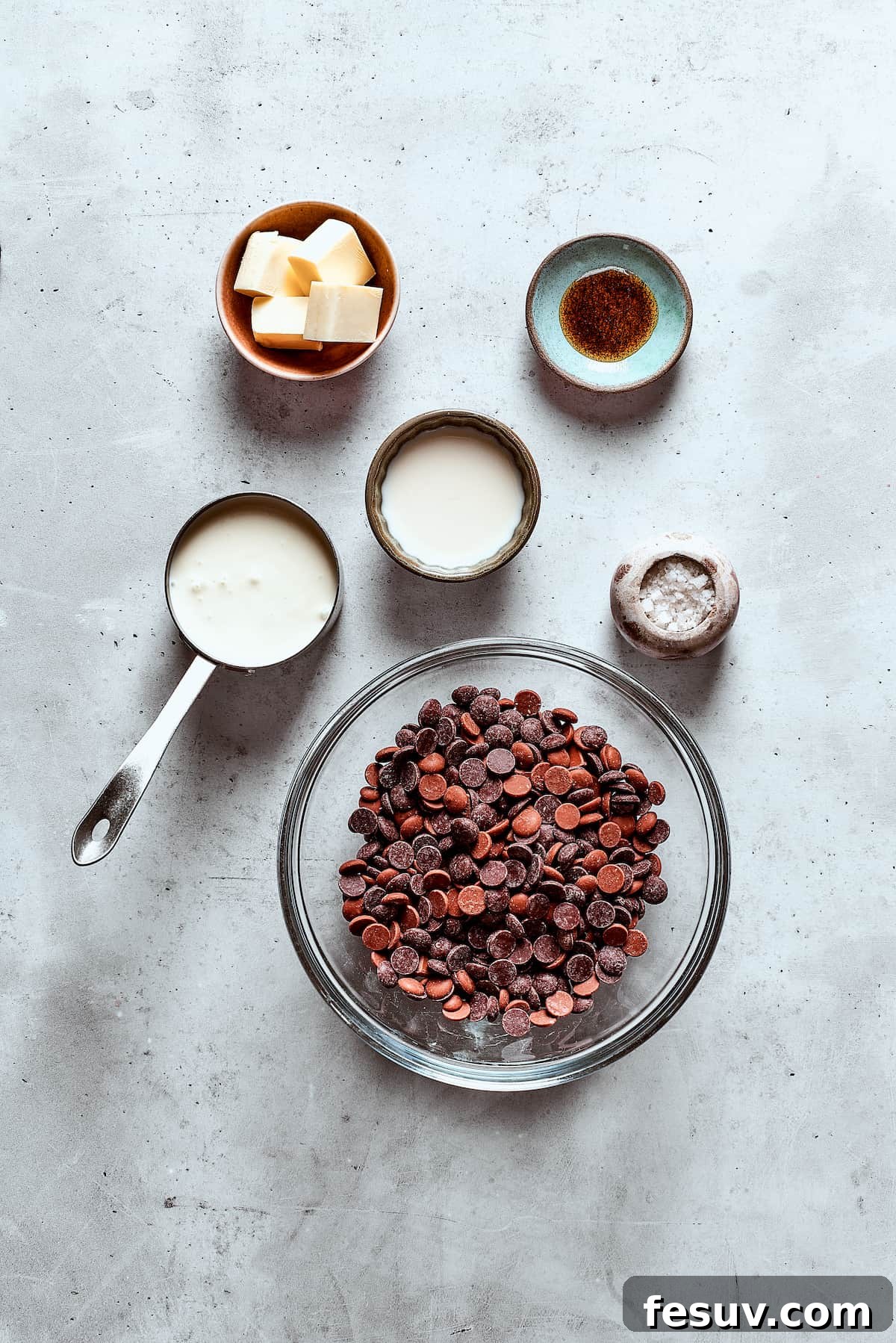 Velvet Chocolate Fondue 4 Chocolate fondue ingredients measured and arranged on a table.