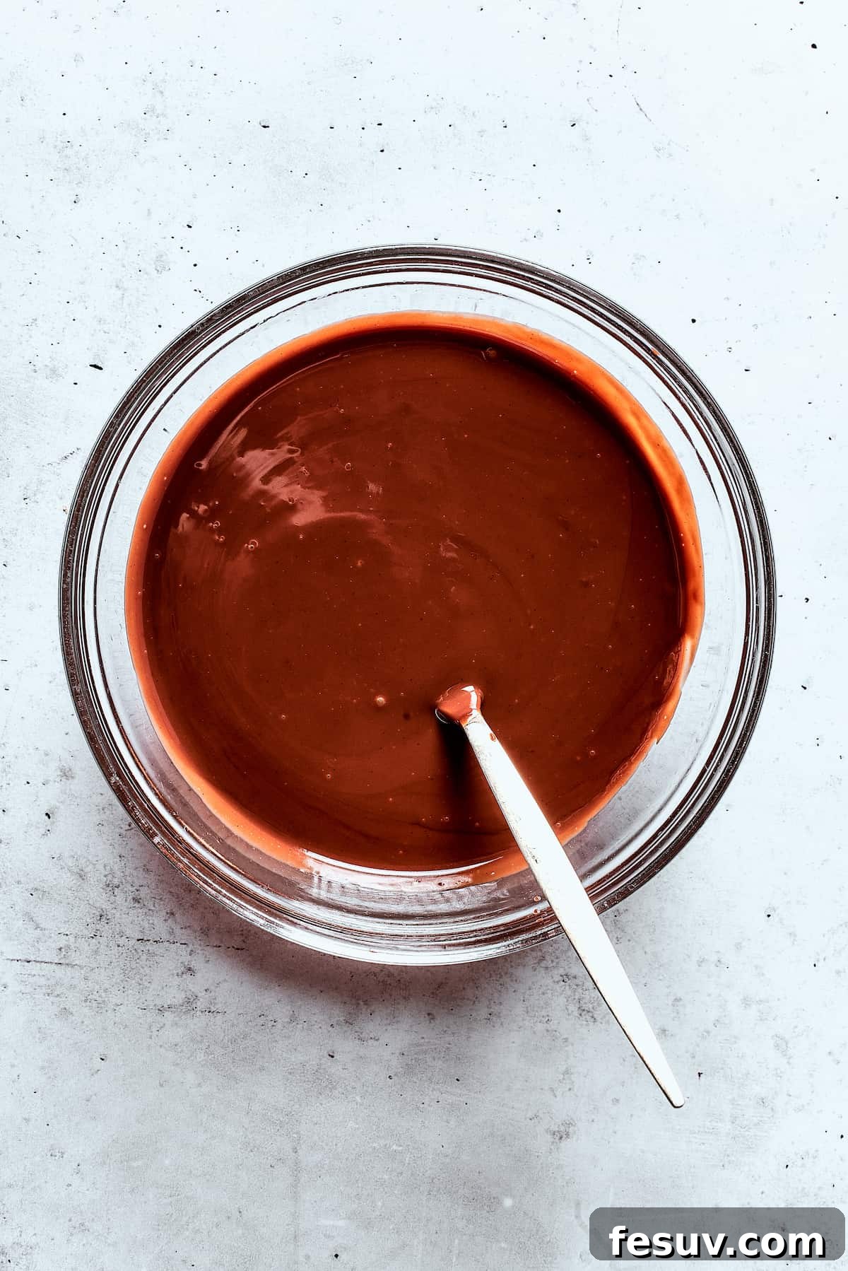 Velvet Chocolate Fondue 8 A bowl of melted chocolate sauce.