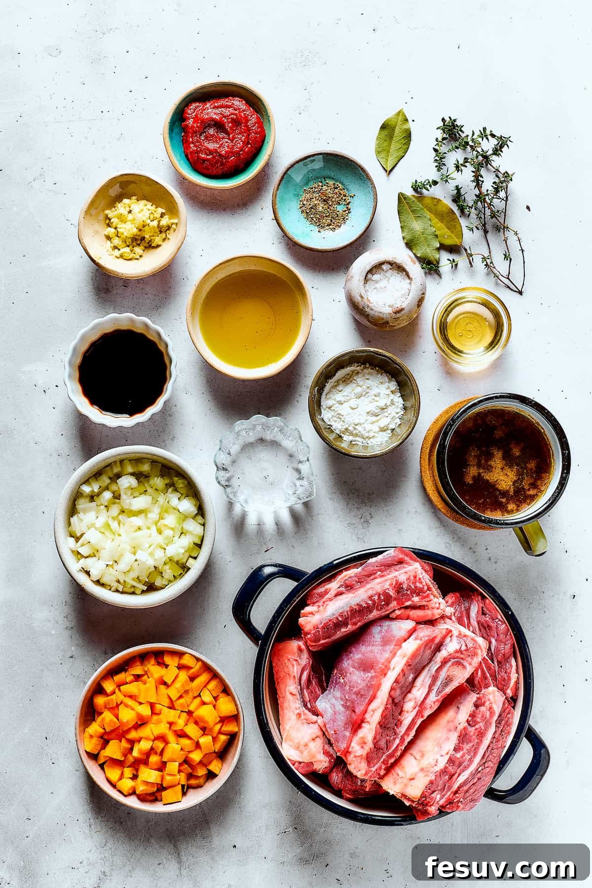 Instant Pot Short Ribs with balsamic sauce are easy to make and so good. Using the Instant Pot gives you irresistibly tender short ribs. Ingredients for Instant Pot short ribs, meticulously measured and thoughtfully arranged on a clean kitchen table.