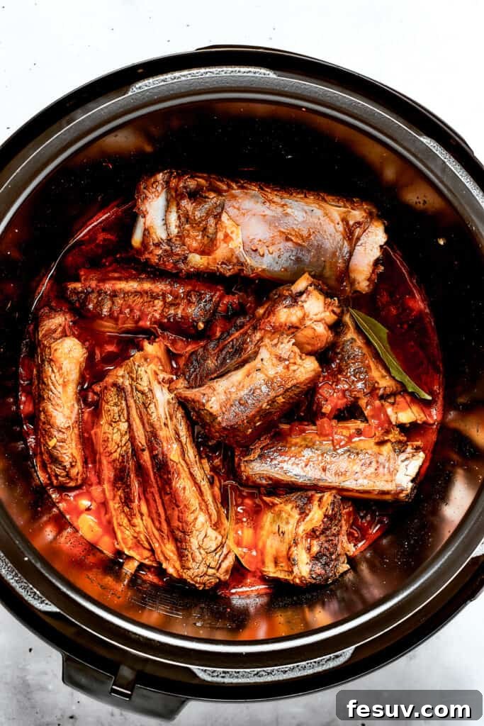 Instant Pot Short Ribs with balsamic sauce are easy to make and so good. Using the Instant Pot gives you irresistibly tender short ribs. Perfectly cooked, fall-apart short ribs resting in the Instant Pot, glistening with their rich sauce.