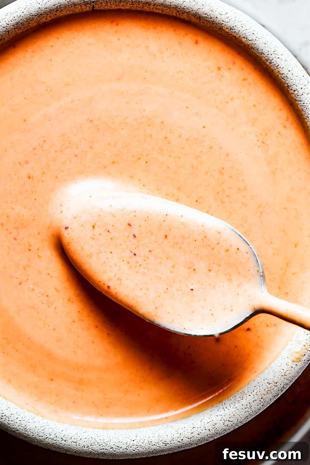 A close-up photo of Homemade yum yum sauce in a bowl.