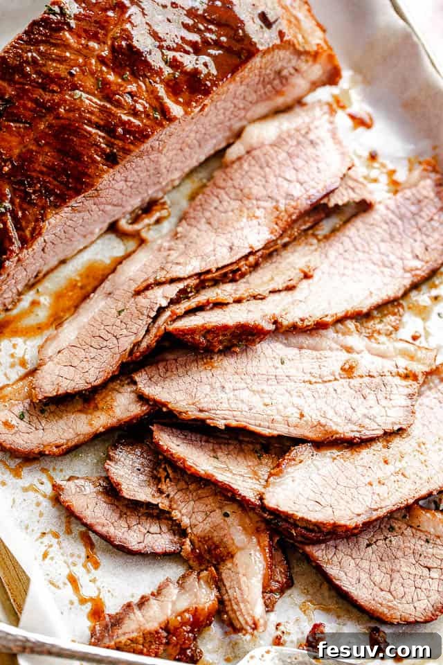 top view of sliced beef brisket set on parchment paper