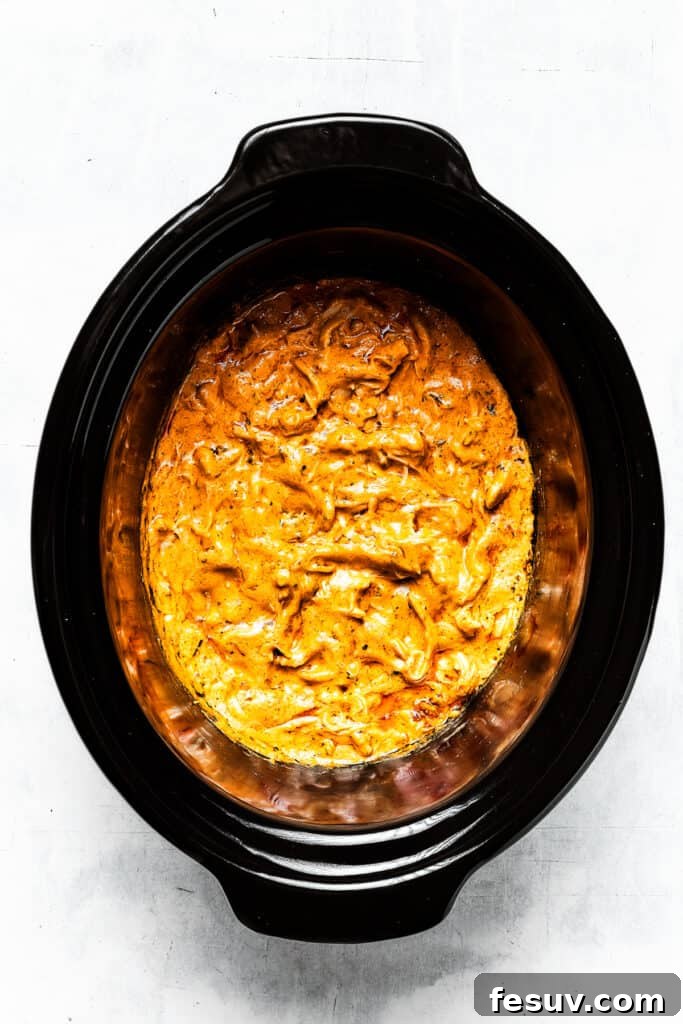 The finished, perfectly cooked Crockpot Buffalo Chicken Dip, hot and bubbly, ready for serving.